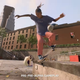 A skateboarder stomps a backside nose blunt on a concrete ledge in Skate.